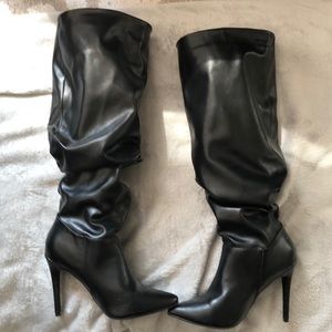 Slip on knee high spiked boots